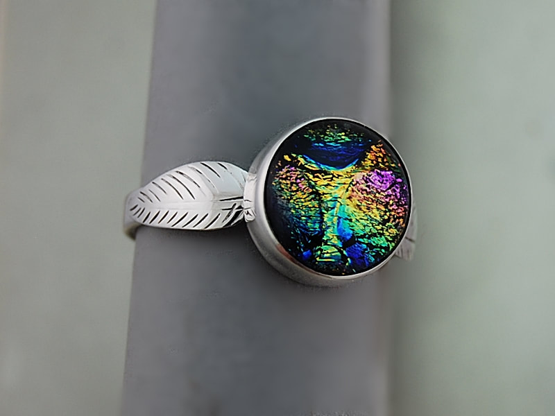 handcrafted green yellow pink and blue dichroic glass ring in sterling silver