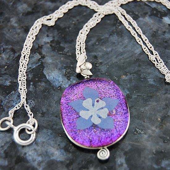 Handmade columbine lavender and silver dichroic mica paper kiln fused on magenta dichroic glass pendant sterling silver wire wrap mountain honeybee bail