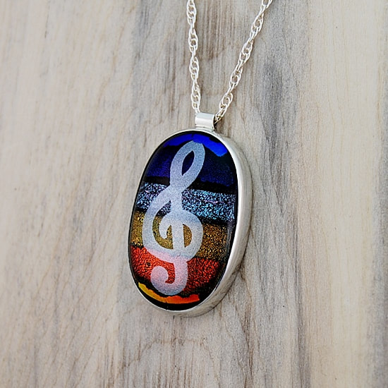sterling silver bezel setting with tube bail for dichroic glass sunrise mosaic with silver treble clef